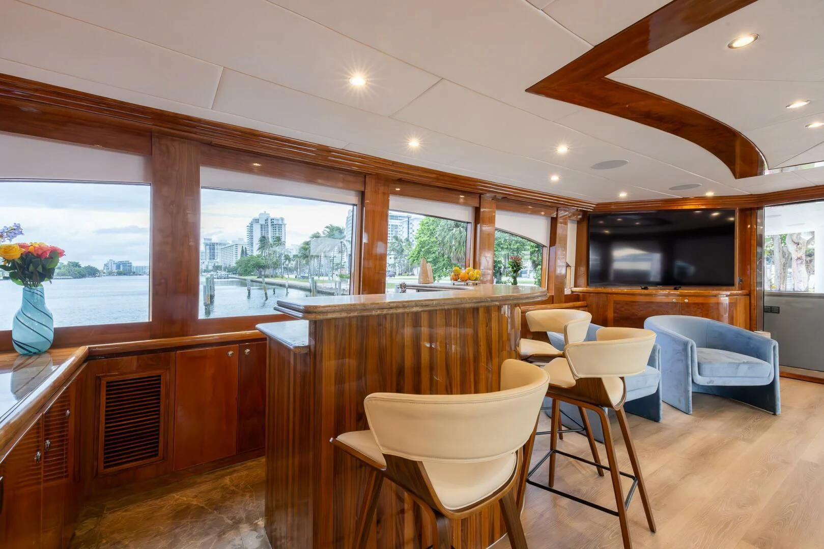 a room with a wood floor and a wood table and chairs aboard OCEAN 1 Yacht for Sale
