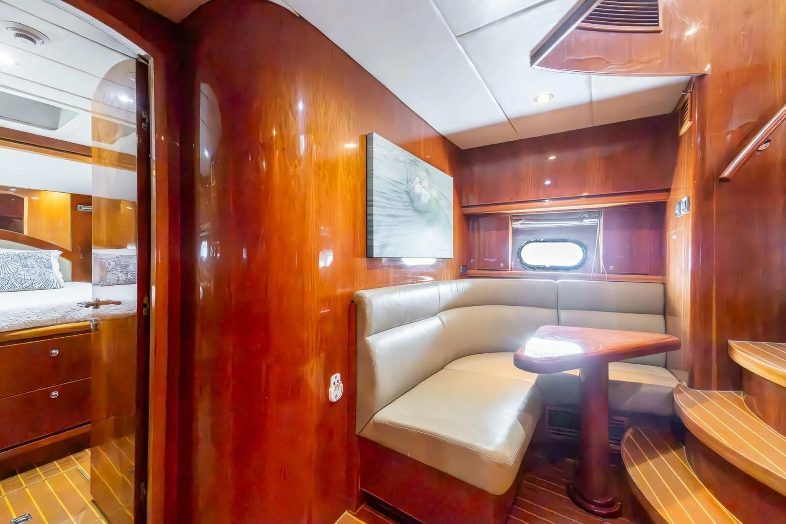 a room with a couch and a table aboard OCEAN 1 Yacht for Sale
