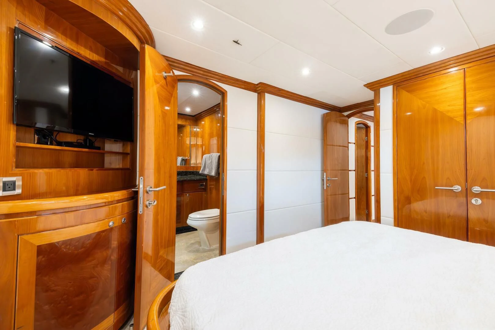 a bathroom with a large white bed aboard OCEAN 1 Yacht for Sale
