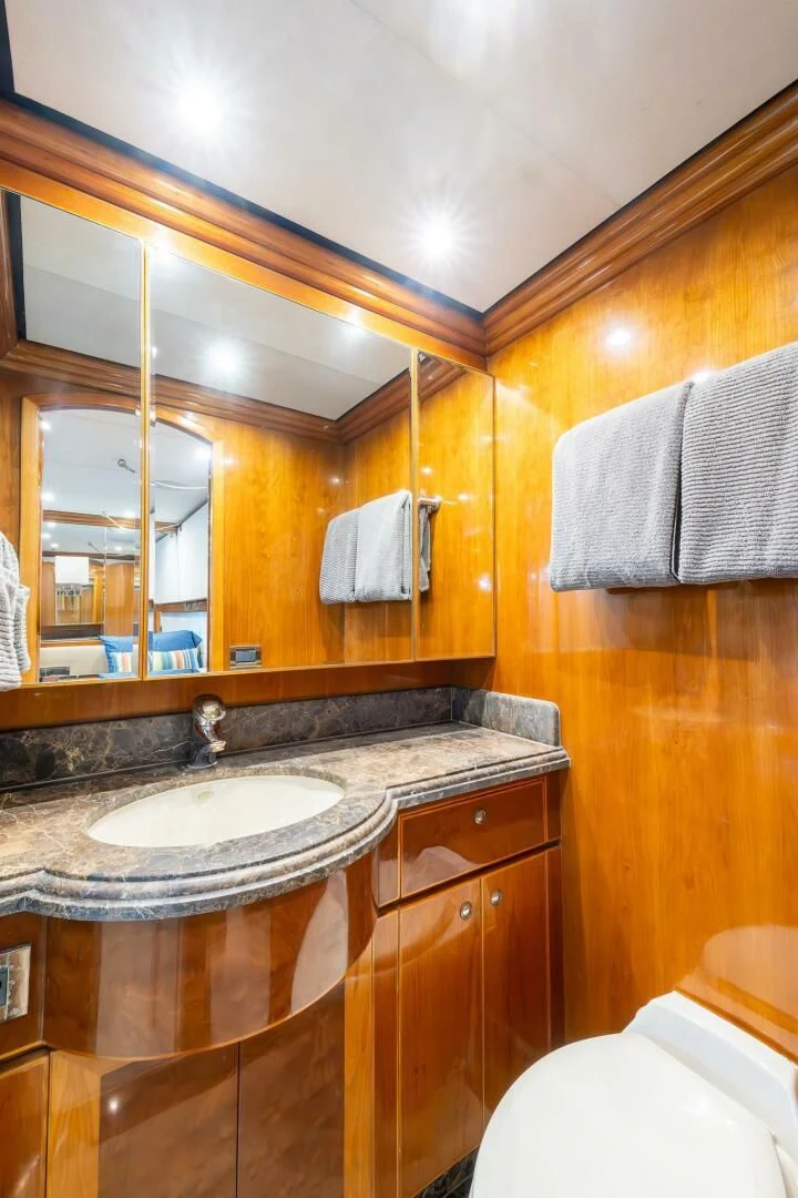 a bathroom with a sink and a mirror aboard OCEAN 1 Yacht for Sale