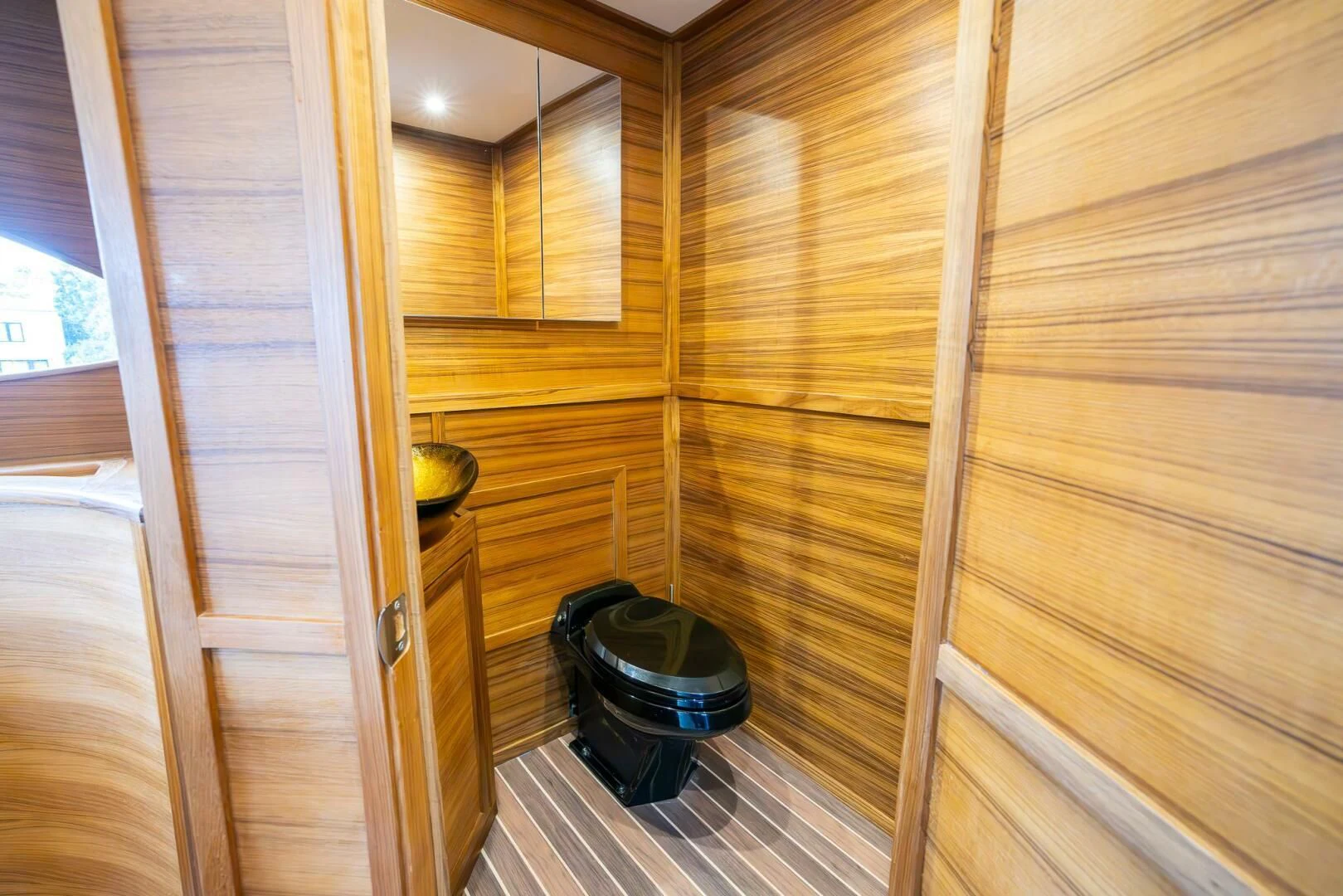 a room with wooden walls aboard OCEAN 1 Yacht for Sale