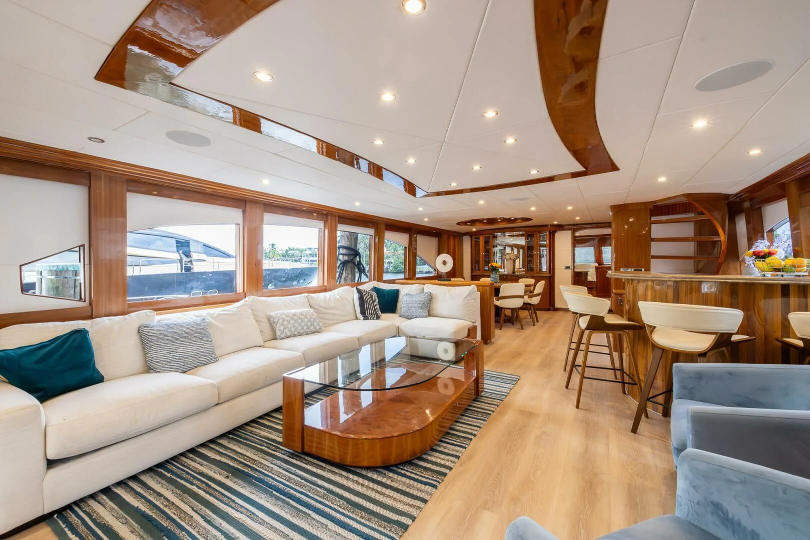 a living room with a large open window aboard OCEAN 1 Yacht for Sale