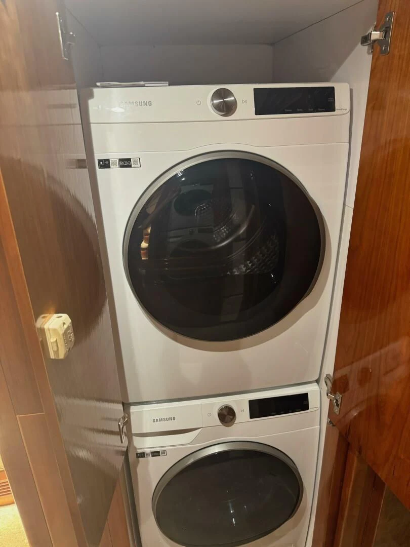 a washing machine in a room aboard OCEAN 1 Yacht for Sale