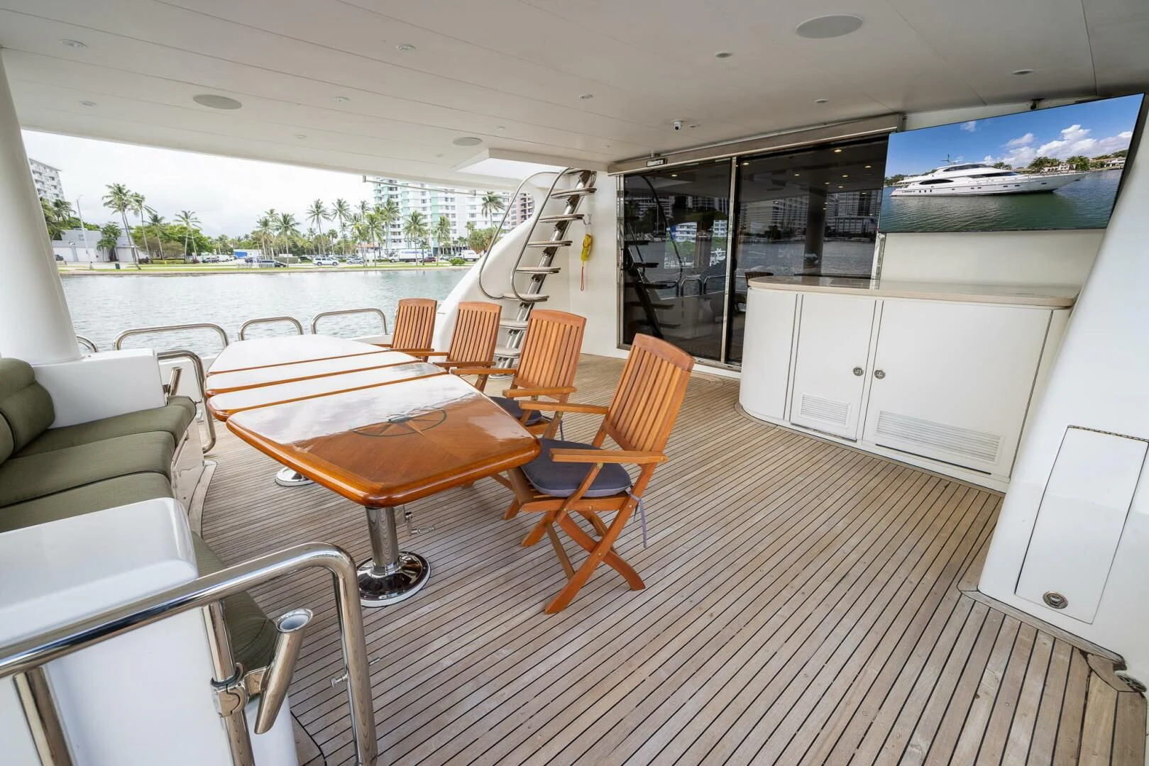 a room with tables and chairs aboard OCEAN 1 Yacht for Sale