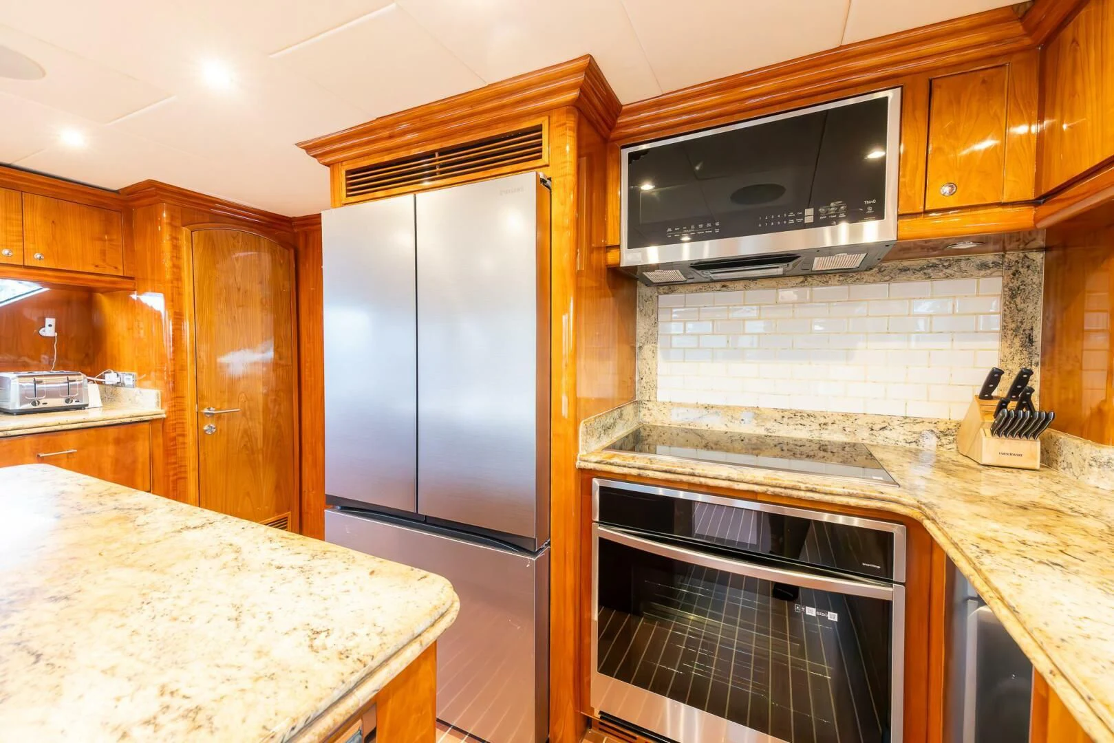 a kitchen with a stainless steel oven aboard OCEAN 1 Yacht for Sale