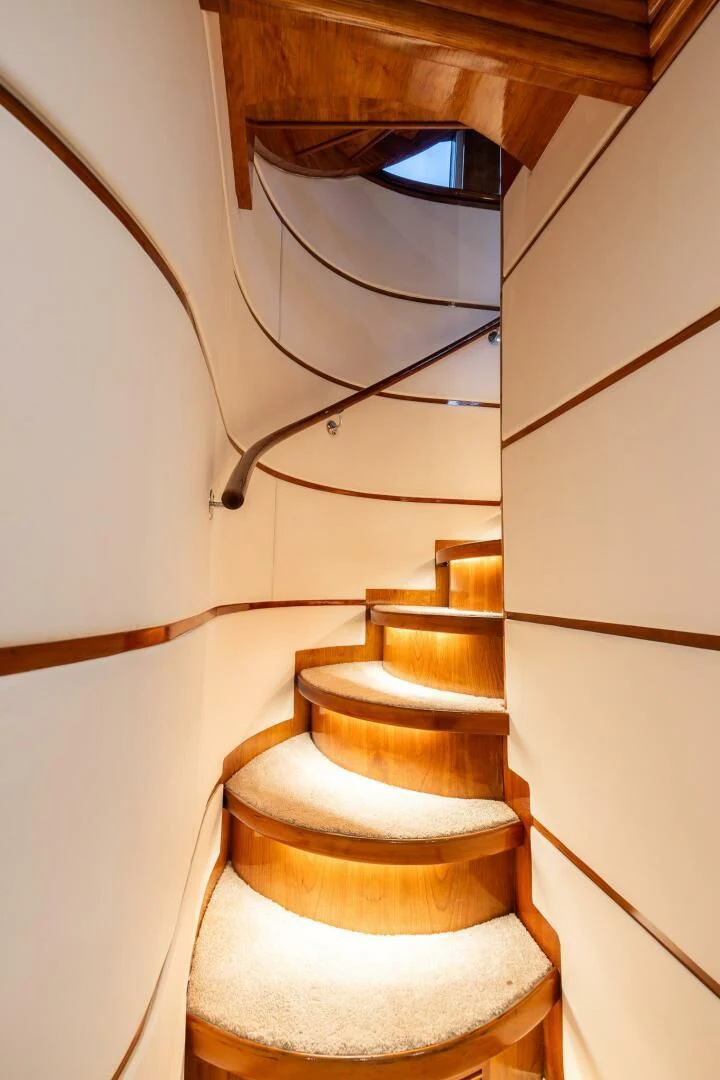a stack of books on a toilet aboard OCEAN 1 Yacht for Sale