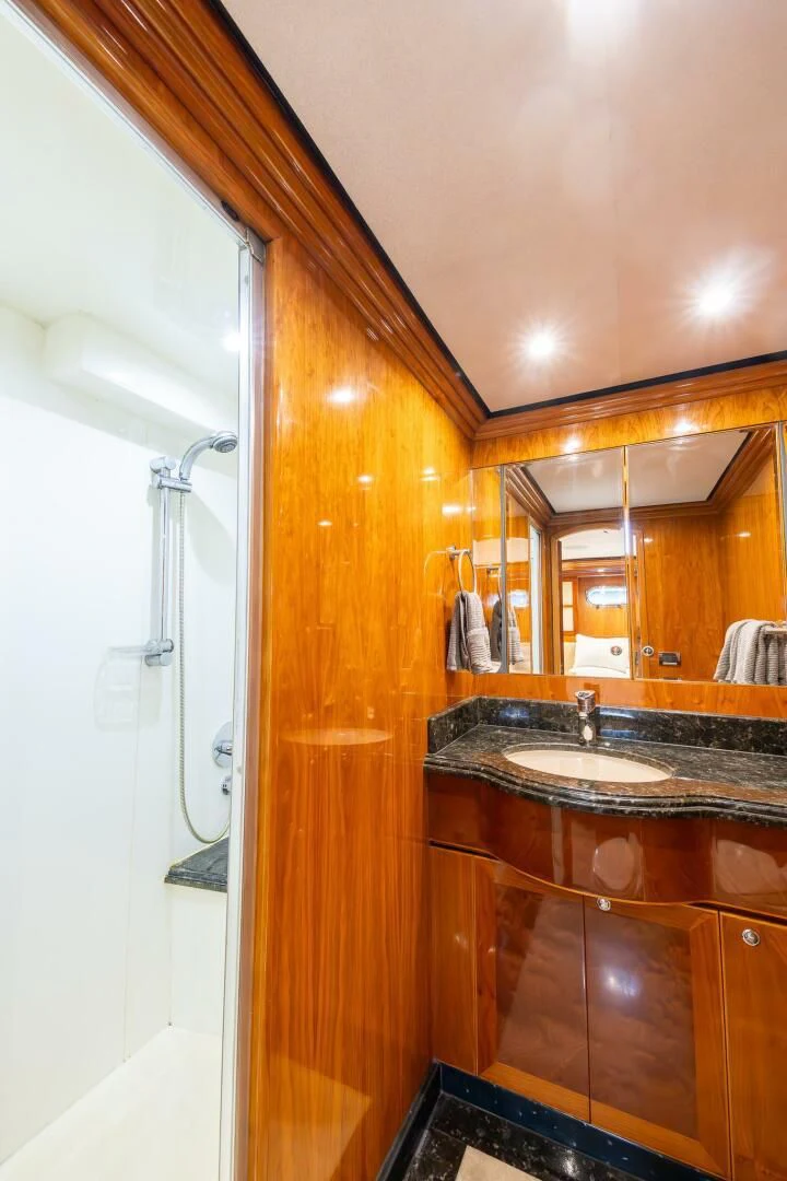 a bathroom with a sink and a shower aboard OCEAN 1 Yacht for Sale