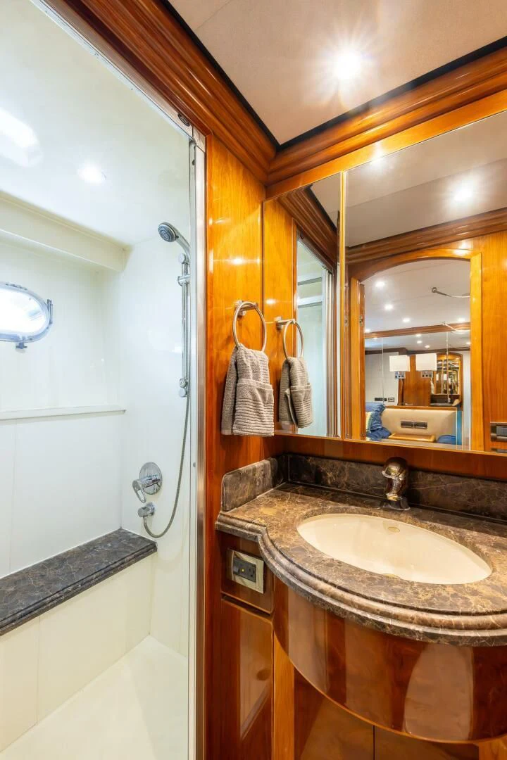 a bathroom with a sink and a mirror aboard OCEAN 1 Yacht for Sale