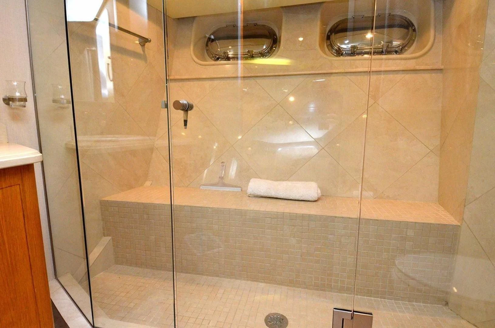 a bathroom with a glass shower aboard AVALON Yacht for Sale