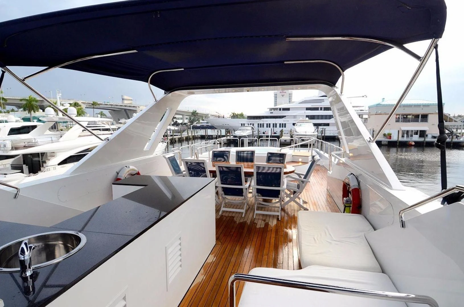 a boat with a deck and chairs aboard AVALON Yacht for Sale