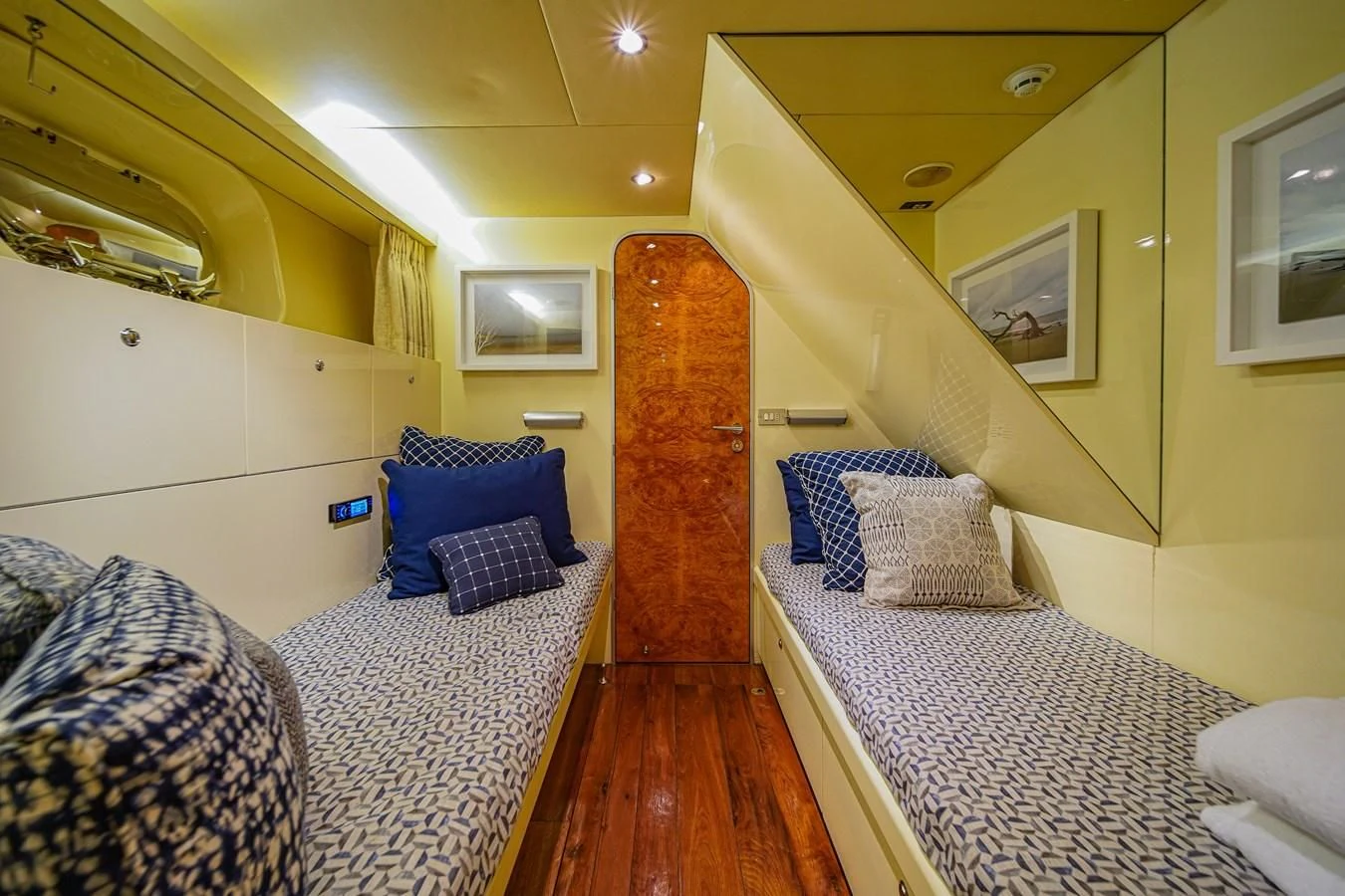 a bedroom with a bed and a door aboard AVALON Yacht for Sale