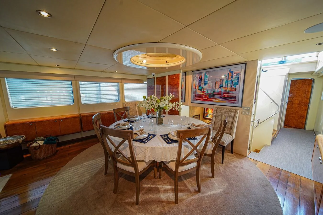 a dining room with a table and chairs aboard AVALON Yacht for Sale