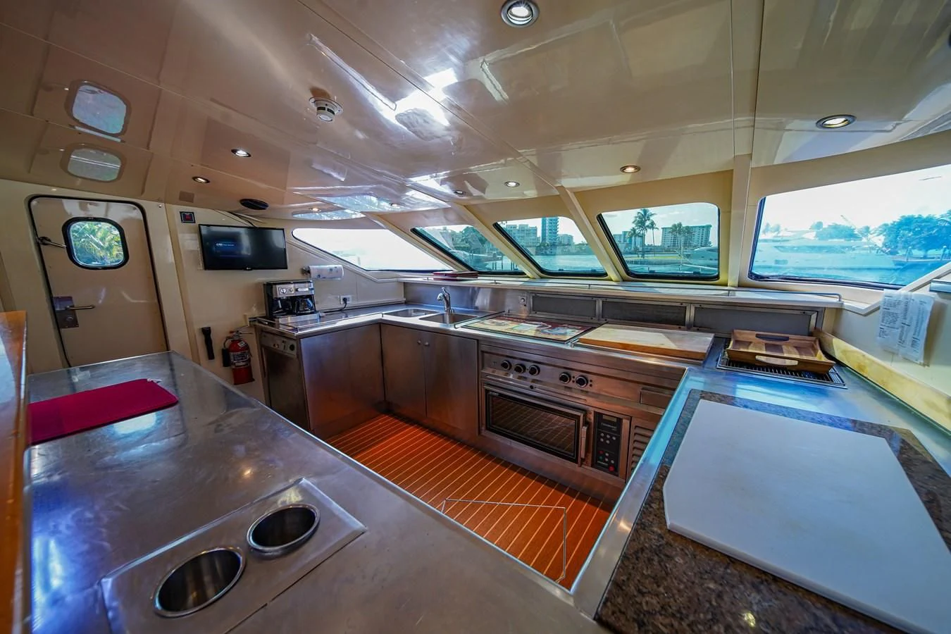 a kitchen with a large island aboard AVALON Yacht for Sale