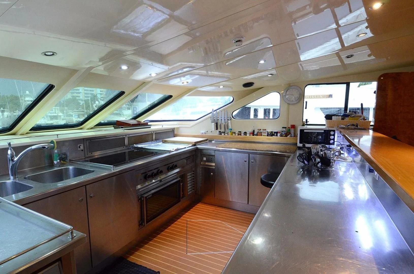 a kitchen with a large island aboard AVALON Yacht for Sale