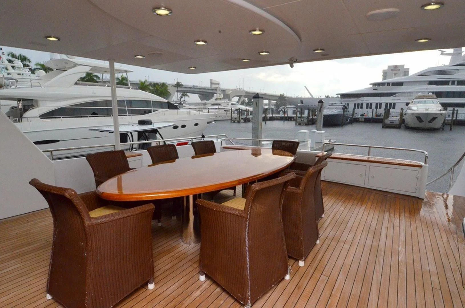 a room with a table chairs and a large group of boats in it aboard AVALON Yacht for Sale