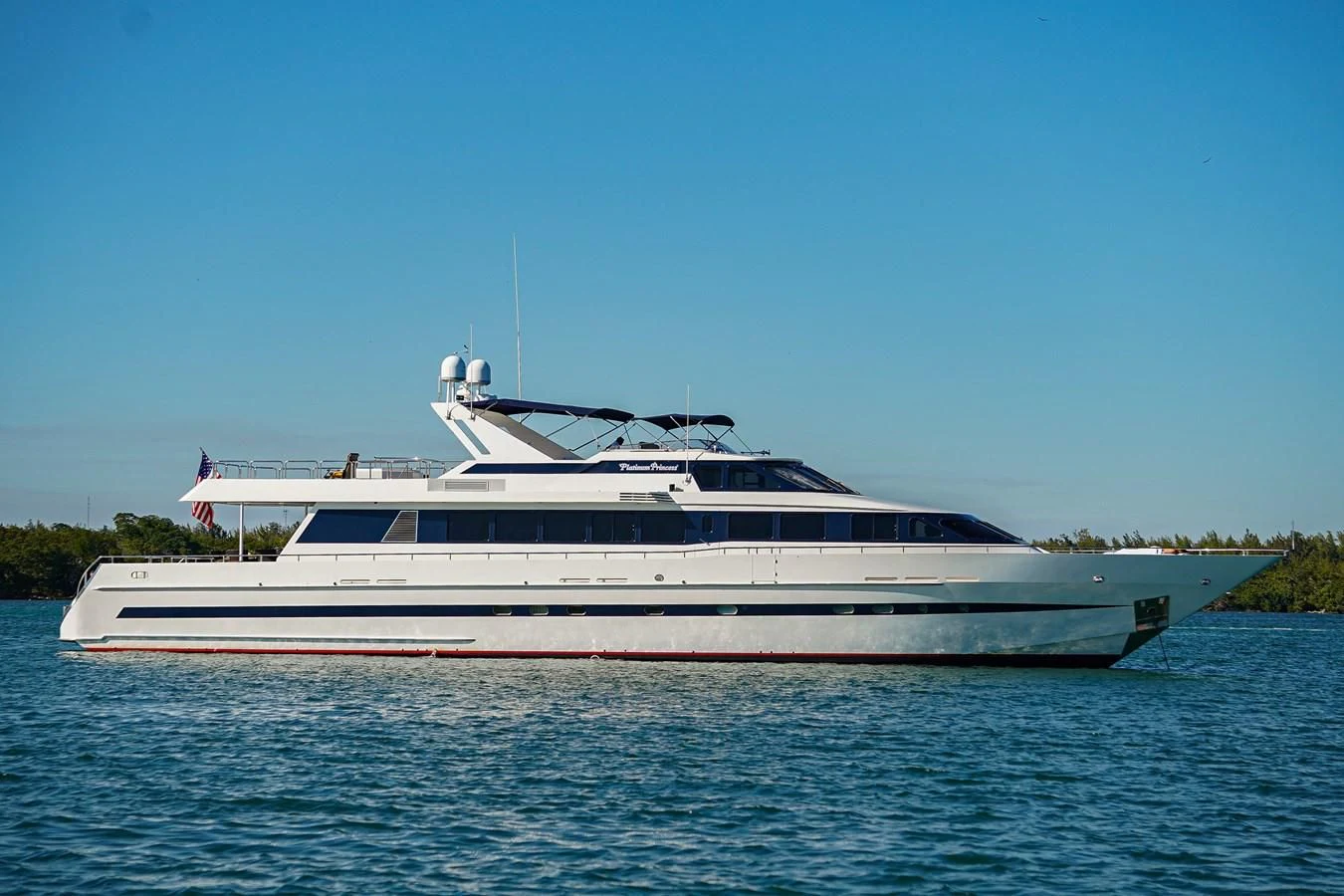 a large white boat on the water aboard AVALON Yacht for Sale