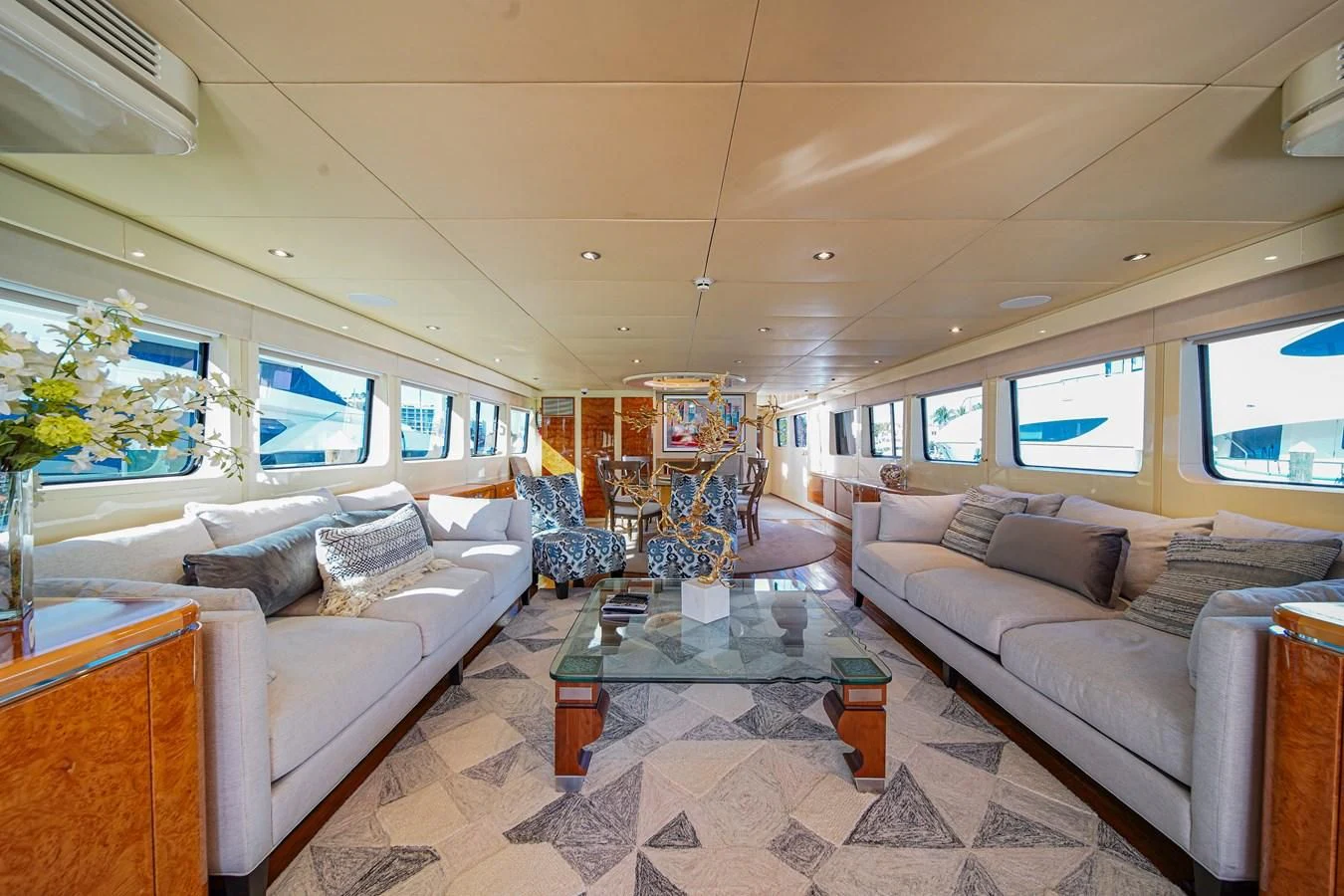 a living room with a couch and a coffee table aboard AVALON Yacht for Sale