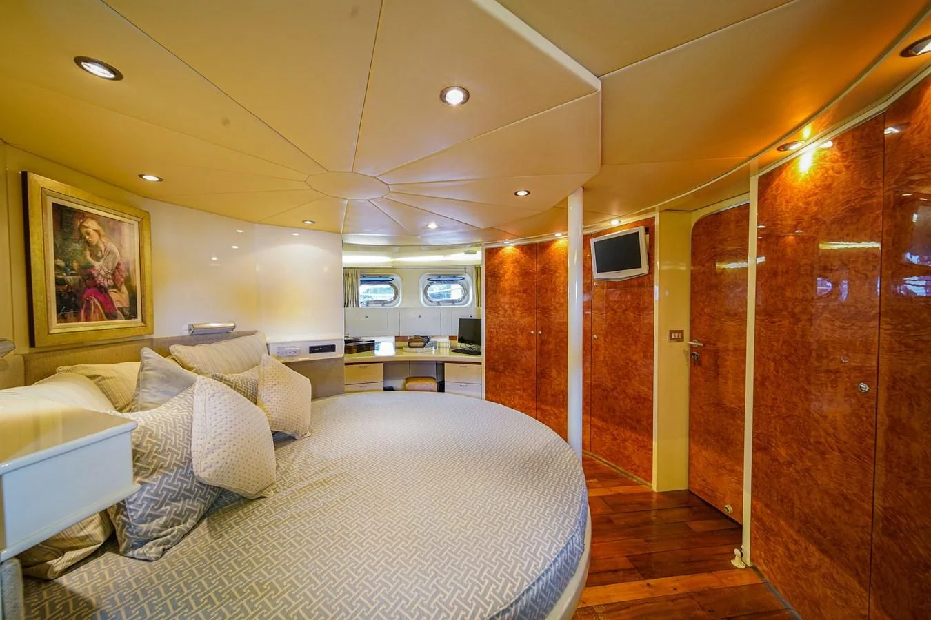 a bedroom with a bed and a door aboard AVALON Yacht for Sale