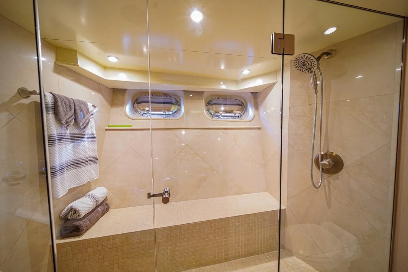 a bathroom with a glass shower aboard AVALON Yacht for Sale