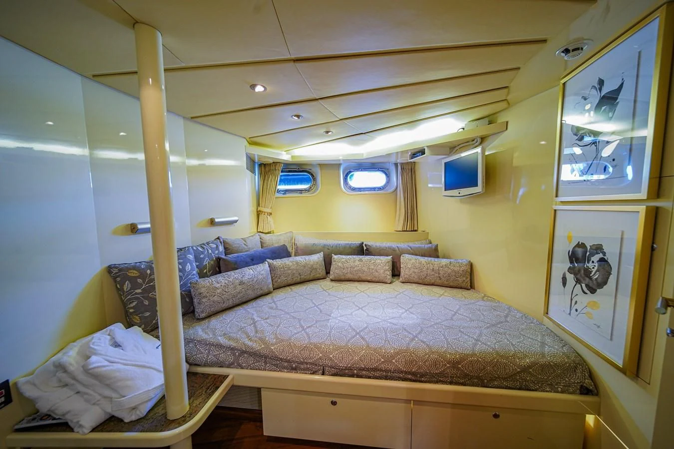 a living room with a couch and a television aboard AVALON Yacht for Sale
