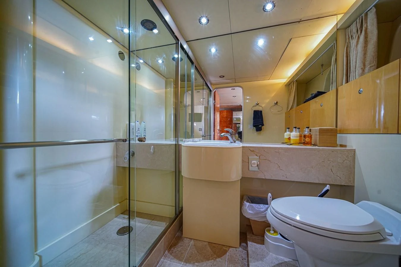 a bathroom with a glass shower aboard AVALON Yacht for Sale