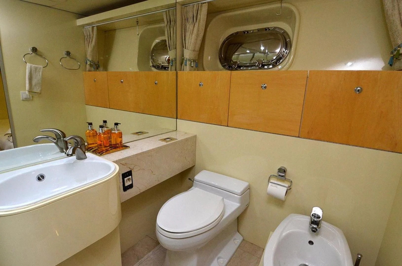 a bathroom with orange cabinets aboard AVALON Yacht for Sale