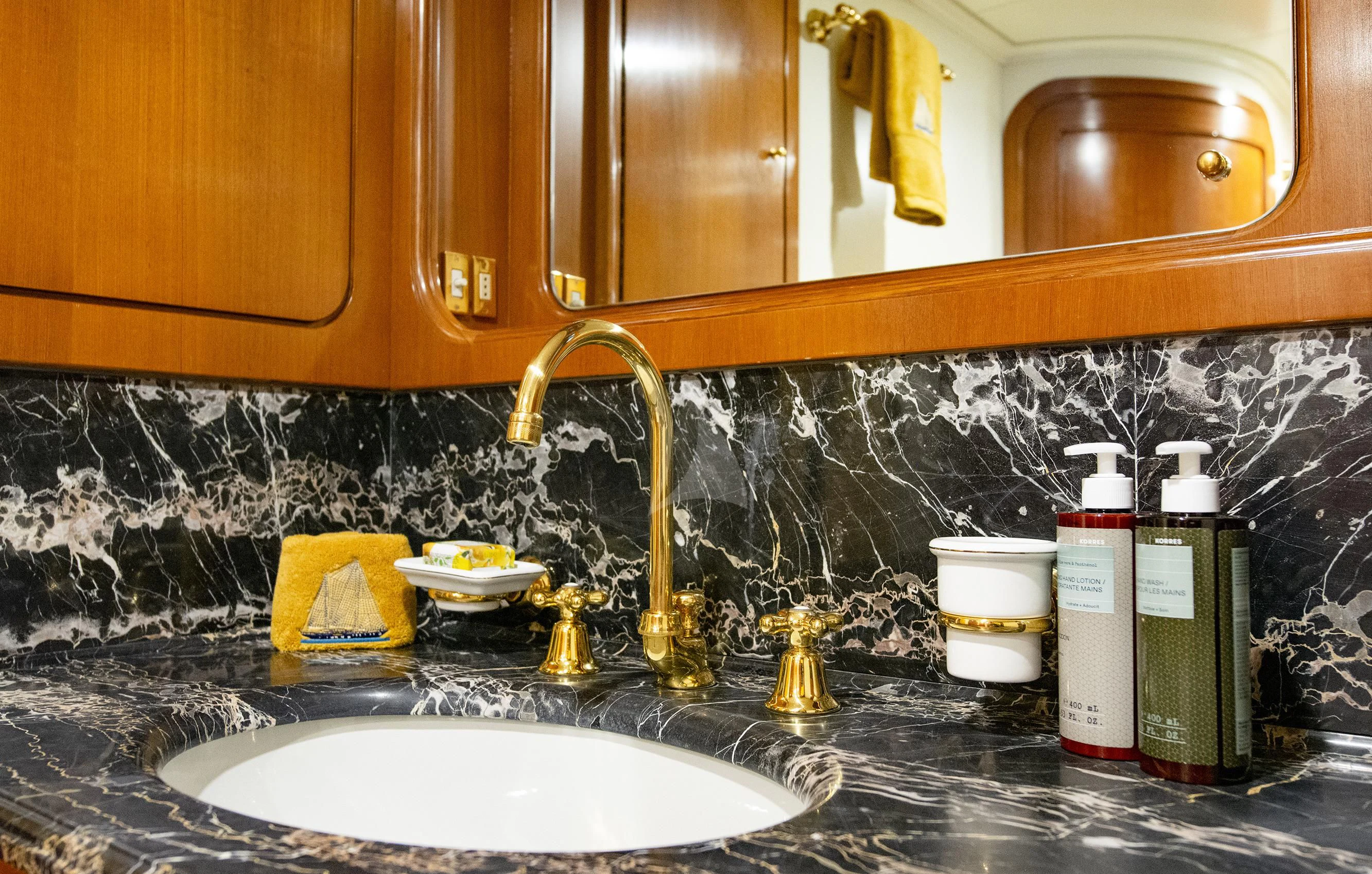 a kitchen sink with a faucet and a countertop aboard TAMARITA Yacht for Sale