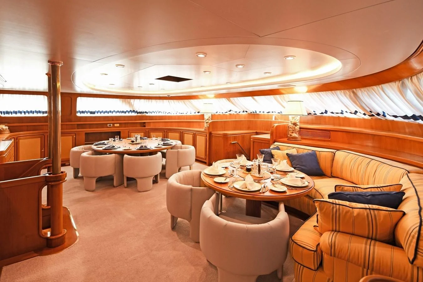 a room with a table and chairs aboard TAMARITA Yacht for Sale