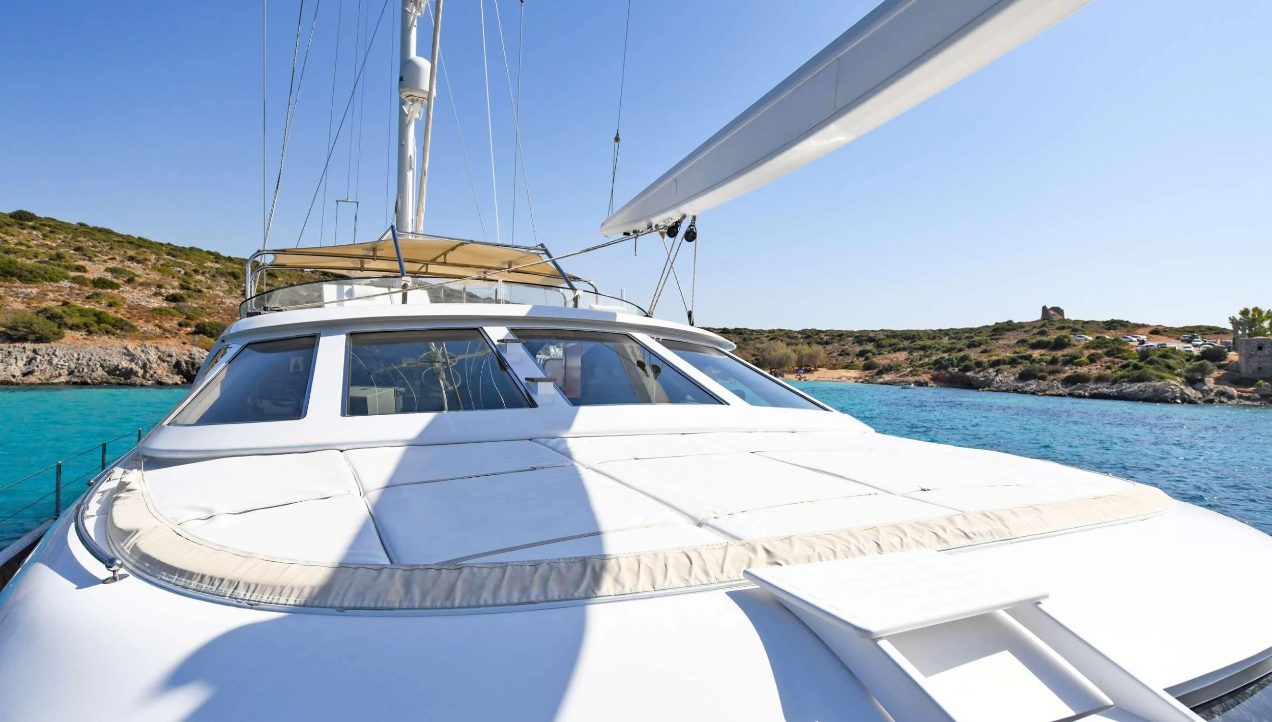a white boat on the water aboard TAMARITA Yacht for Sale
