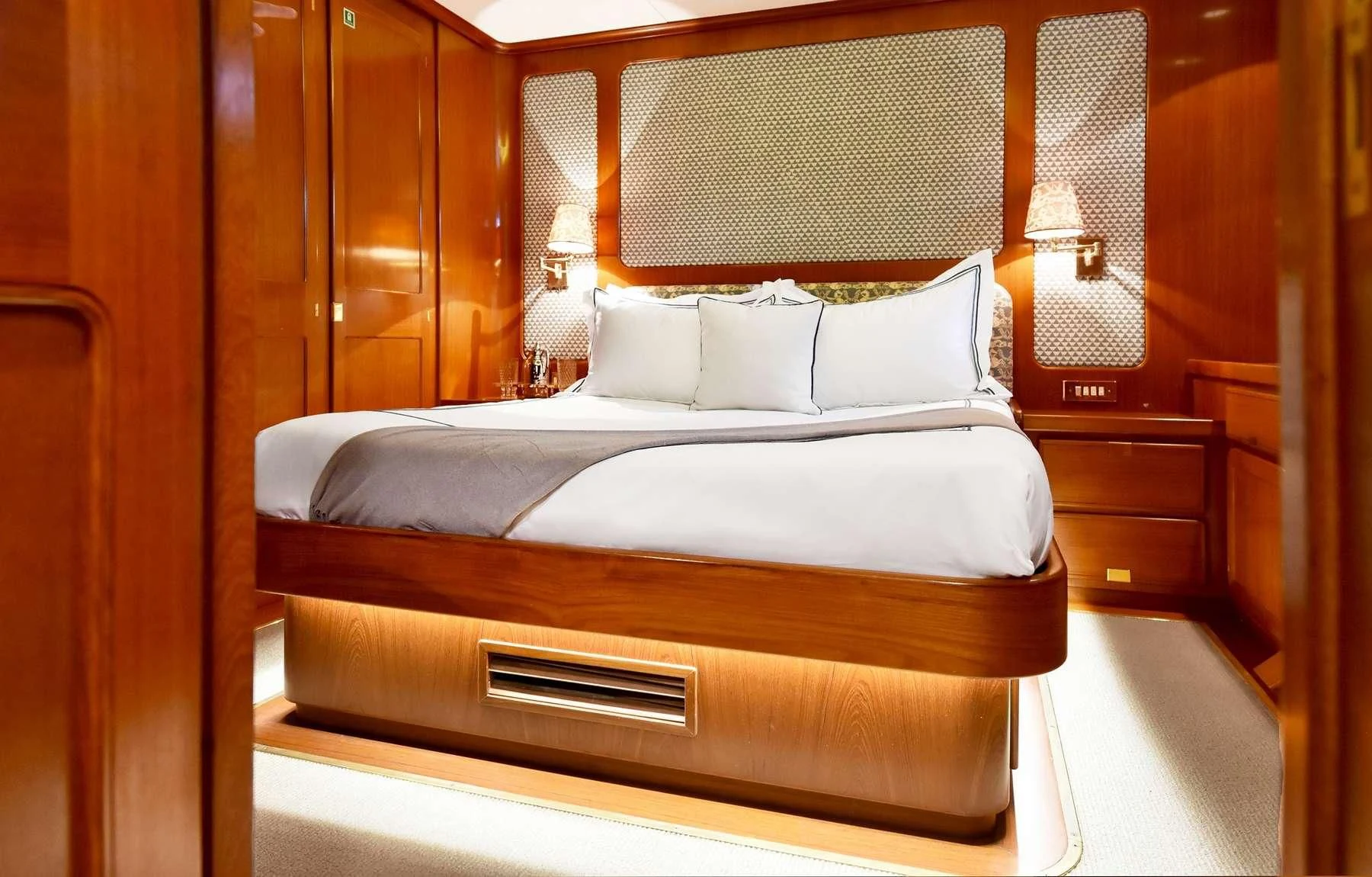 a bed with white sheets aboard TAMARITA Yacht for Sale