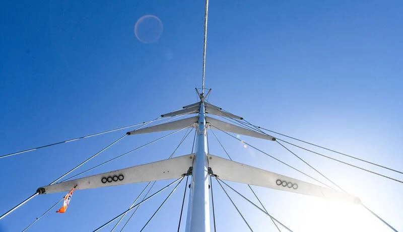 a pole with cables and a blue sky aboard TAMARITA Yacht for Sale