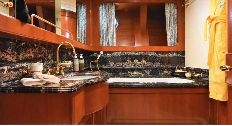a kitchen with a marble counter top aboard TAMARITA Yacht for Sale