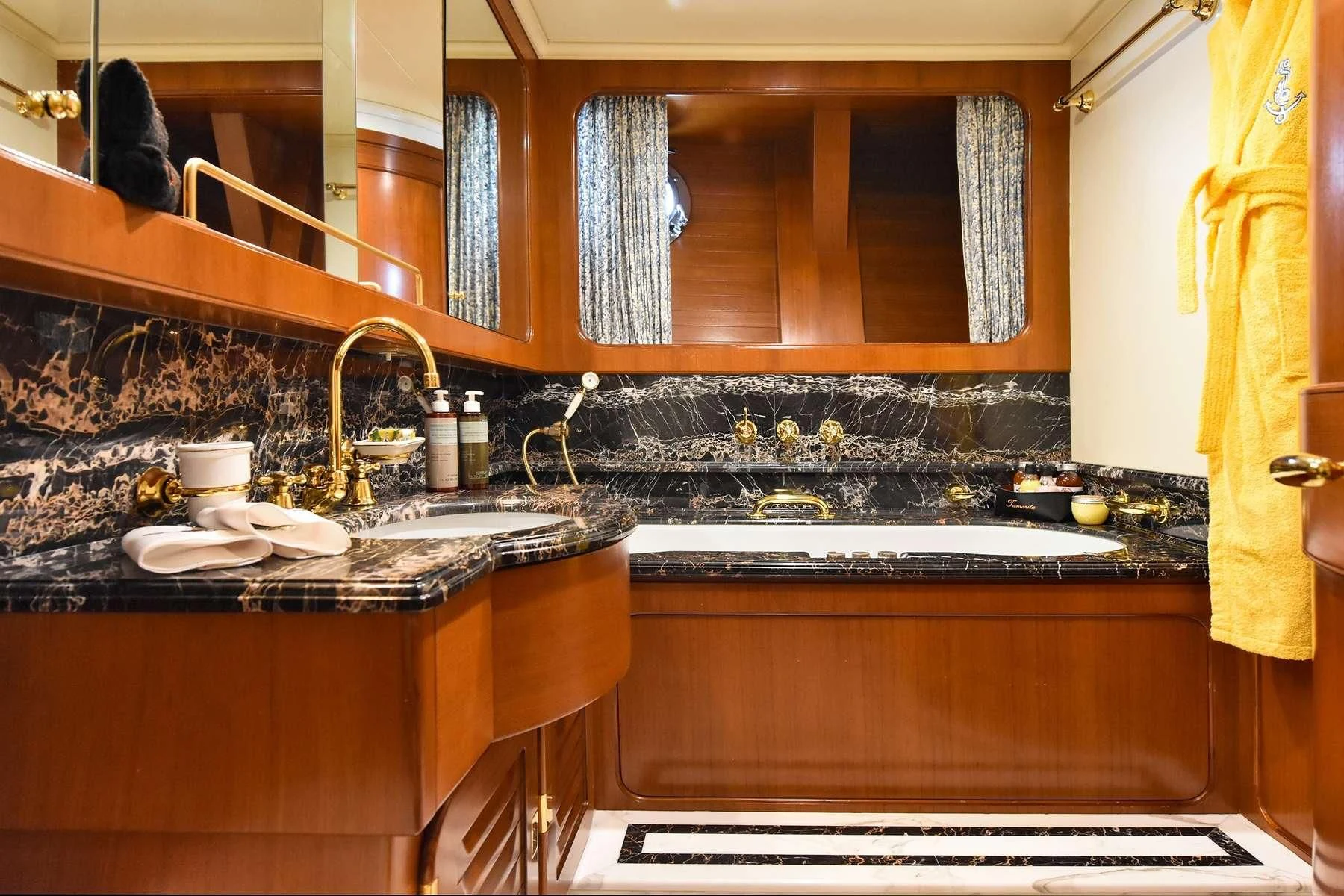 a kitchen with a sink and cabinets aboard TAMARITA Yacht for Sale