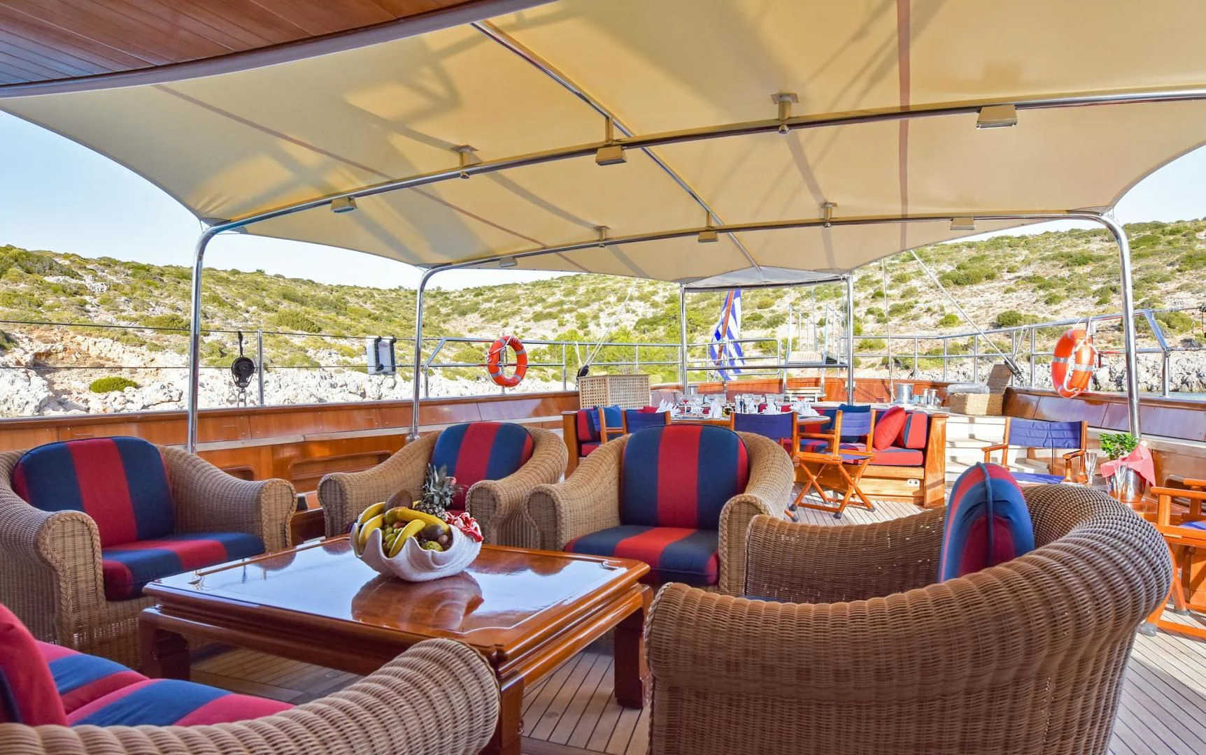 a tent with a table and chairs aboard TAMARITA Yacht for Sale