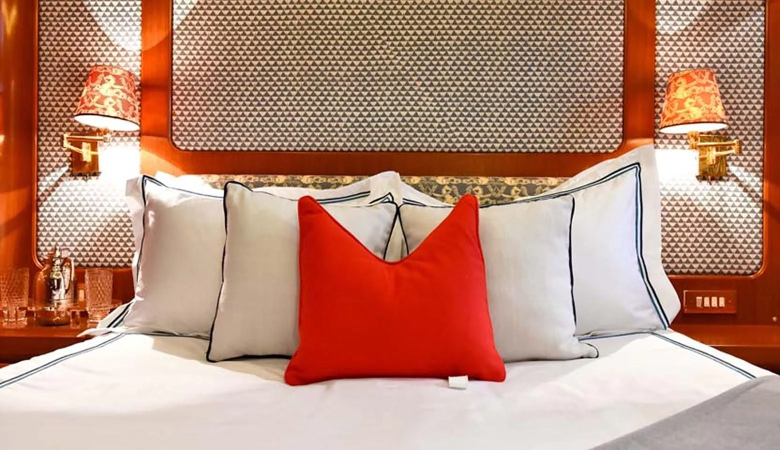 a bed with pillows aboard TAMARITA Yacht for Sale