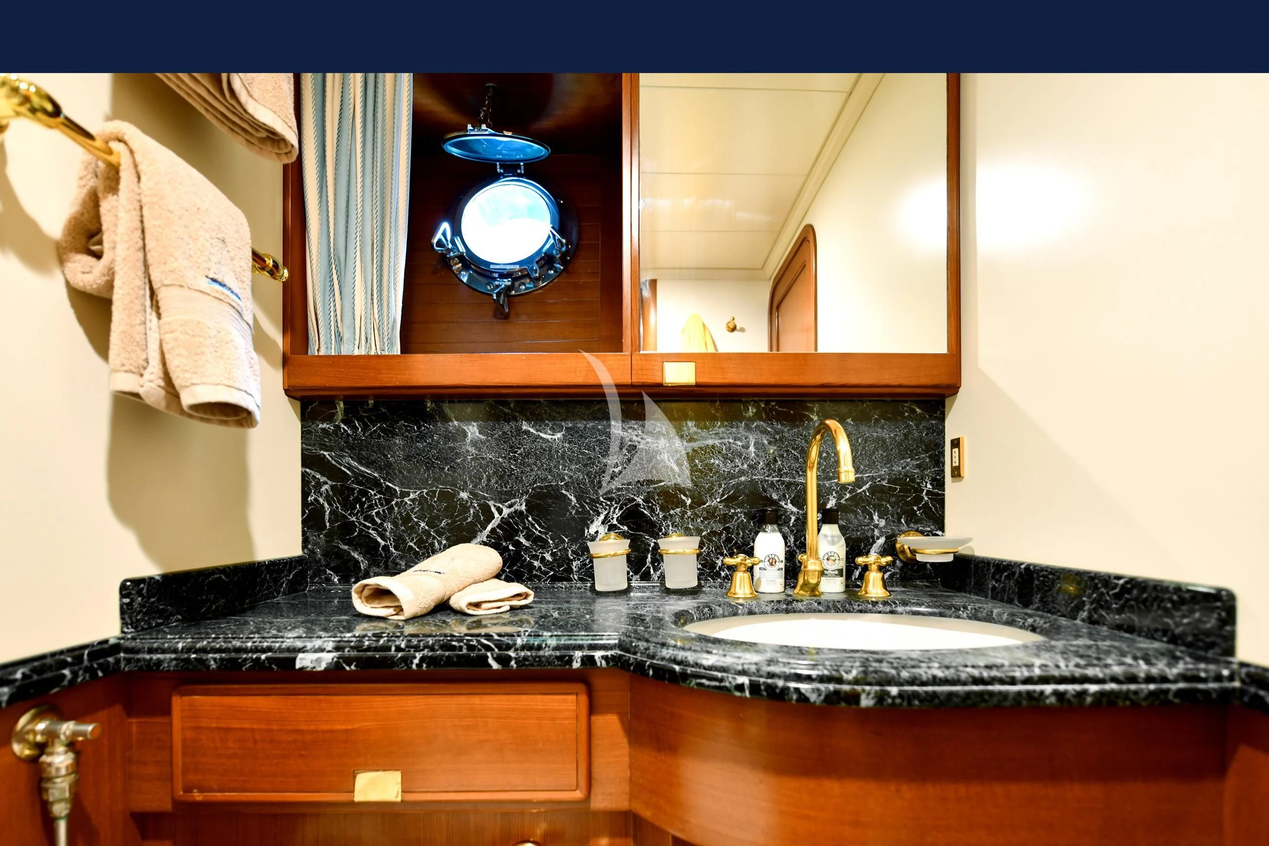 a bathroom with a marble counter top aboard TAMARITA Yacht for Sale