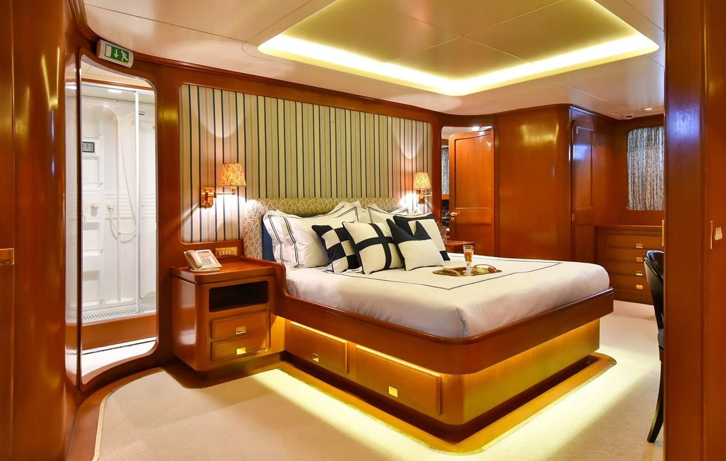 a bed in a room aboard TAMARITA Yacht for Sale