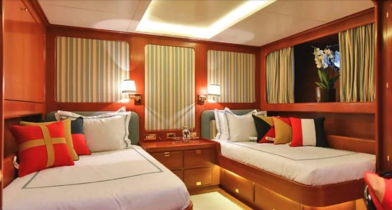 a room with two beds aboard TAMARITA Yacht for Sale