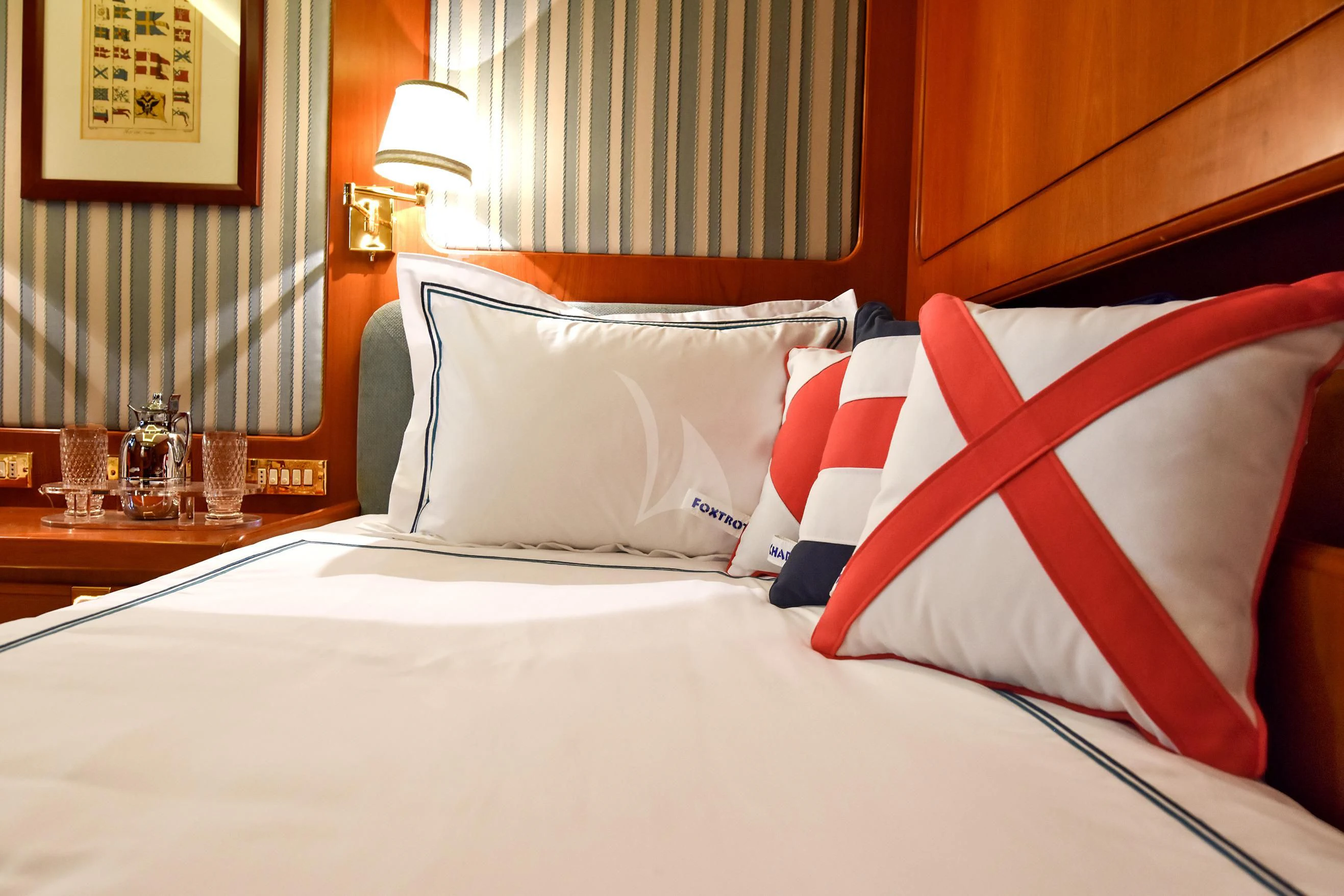 a bed with pillows aboard TAMARITA Yacht for Sale