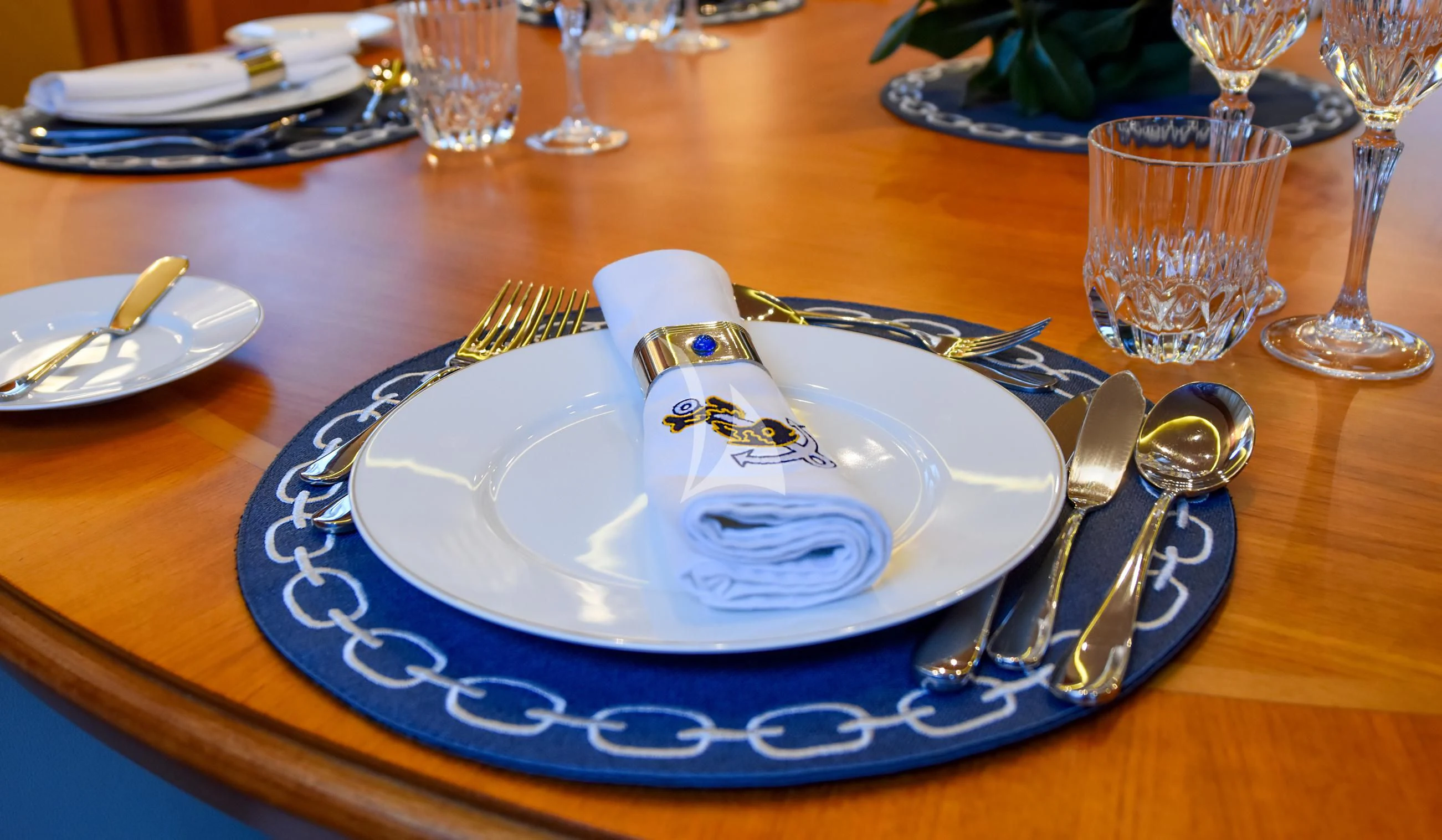 a plate with a fork and knife on it aboard TAMARITA Yacht for Sale
