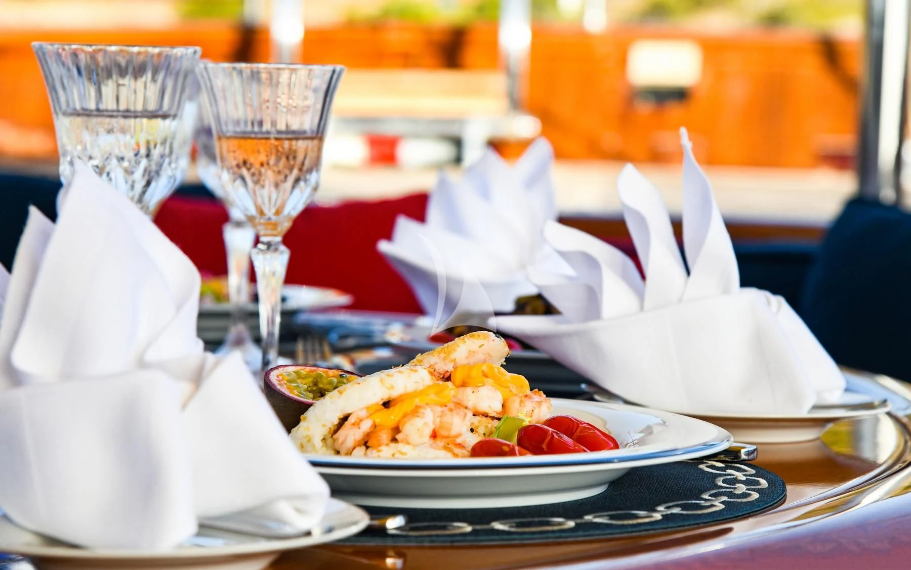 a table with food and drinks aboard TAMARITA Yacht for Sale