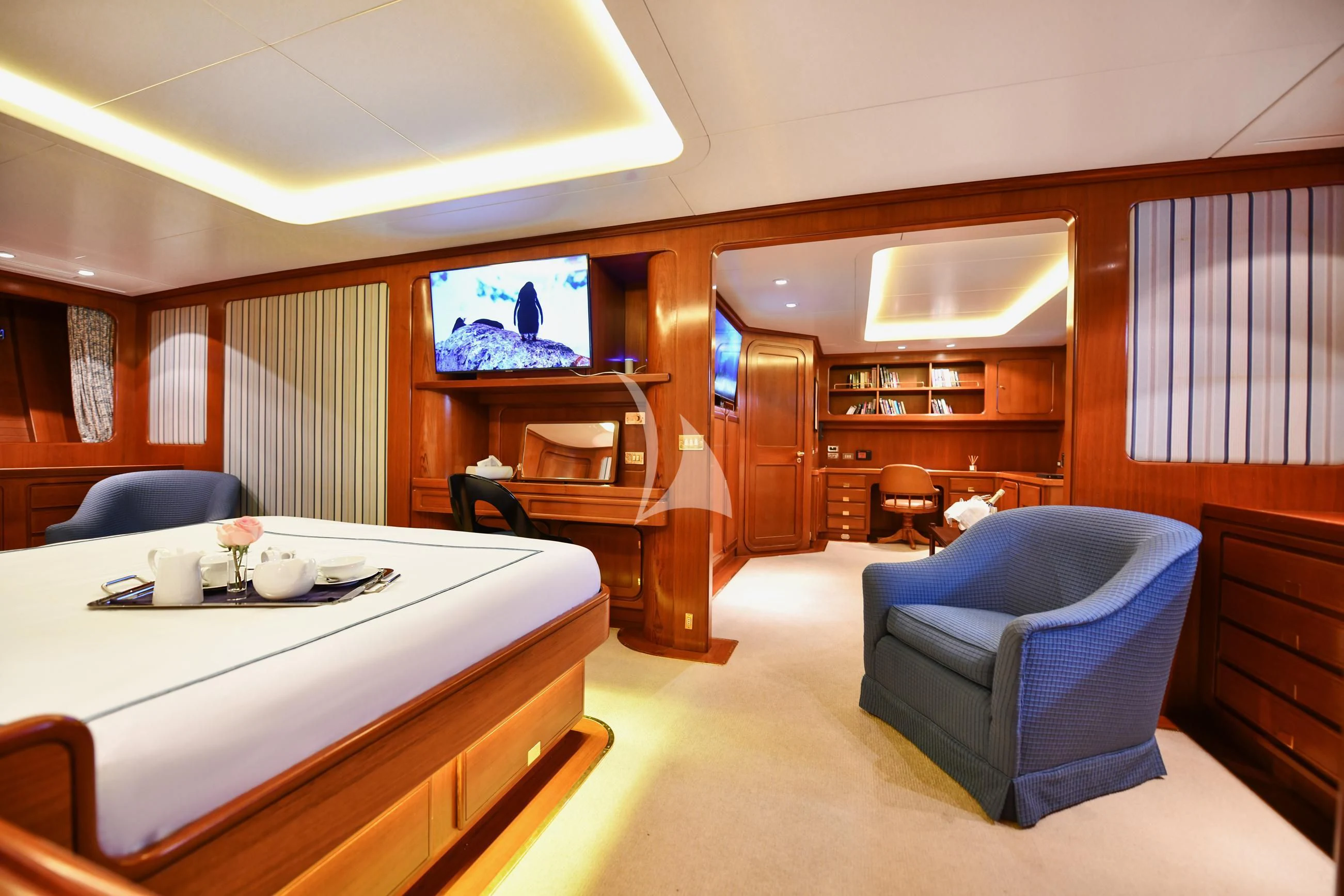 a room with a table and chairs aboard TAMARITA Yacht for Sale