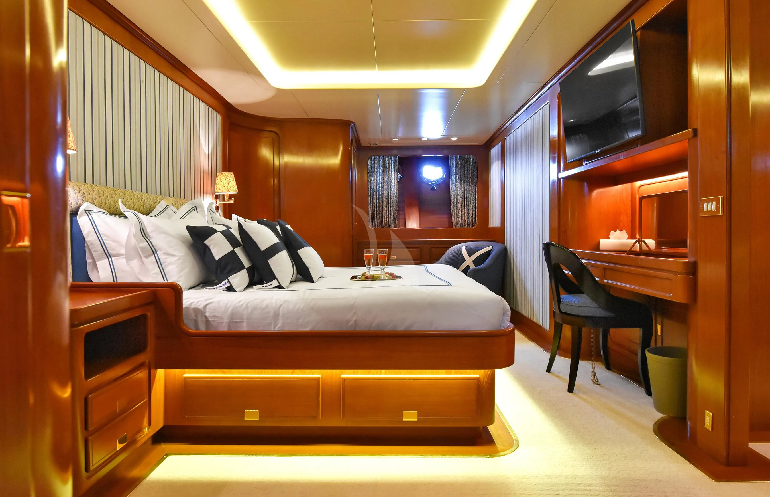a bed in a room aboard TAMARITA Yacht for Sale