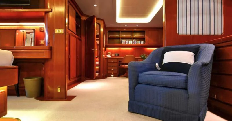 a room with a couch and a chair aboard TAMARITA Yacht for Sale