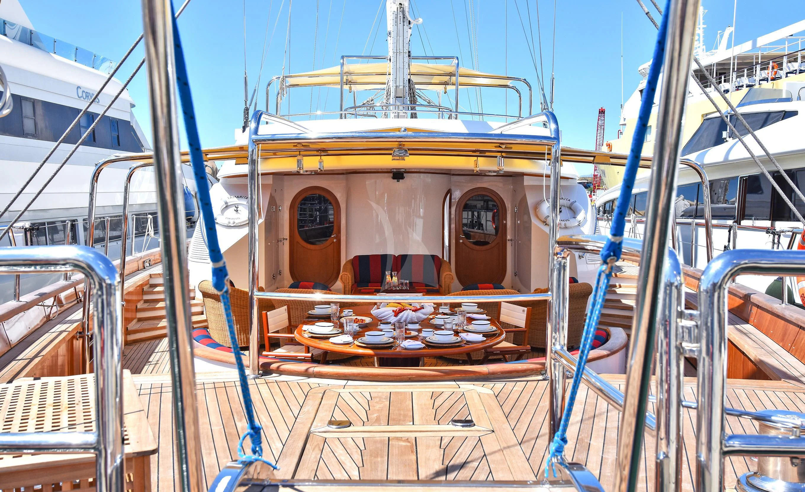 a large ship in a harbor aboard TAMARITA Yacht for Sale