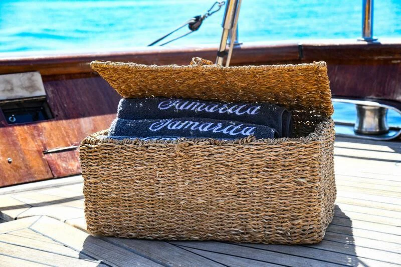 a stack of wood aboard TAMARITA Yacht for Sale