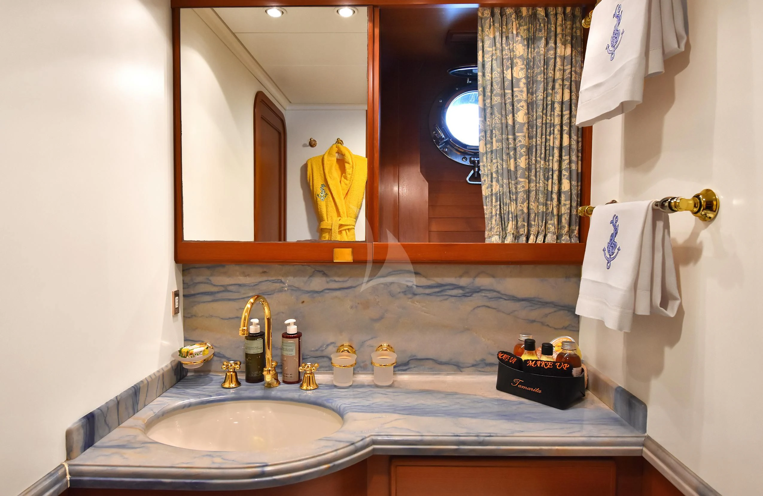 a bathroom with a large mirror aboard TAMARITA Yacht for Sale