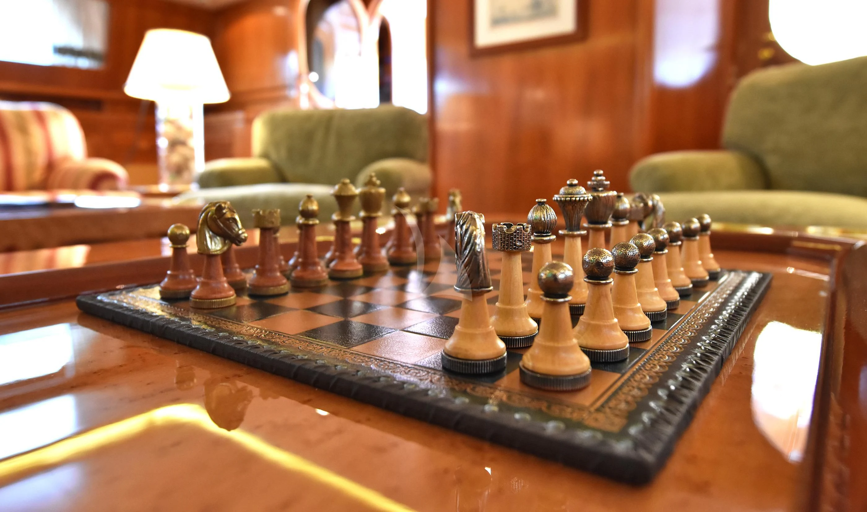 a chess board with a game board aboard TAMARITA Yacht for Sale
