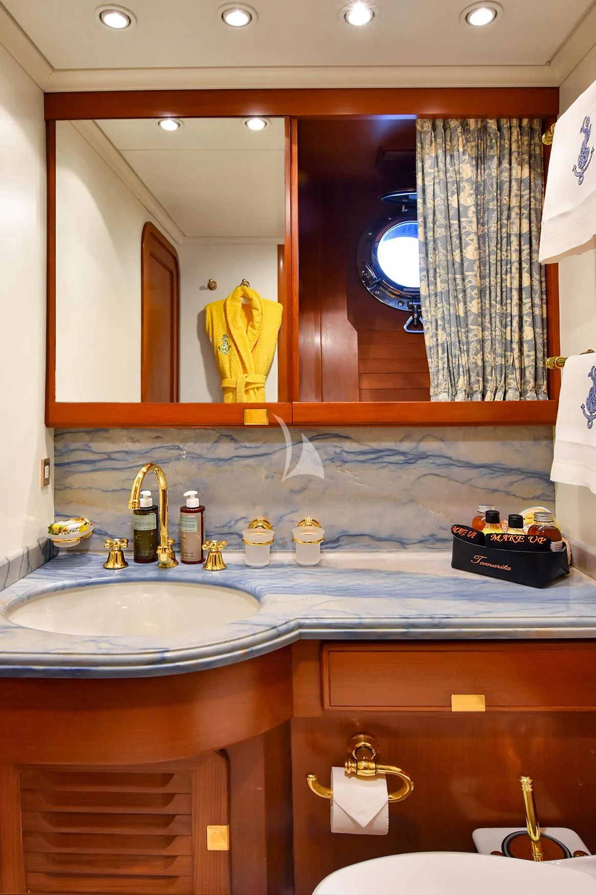 a bathroom with a large mirror aboard TAMARITA Yacht for Sale