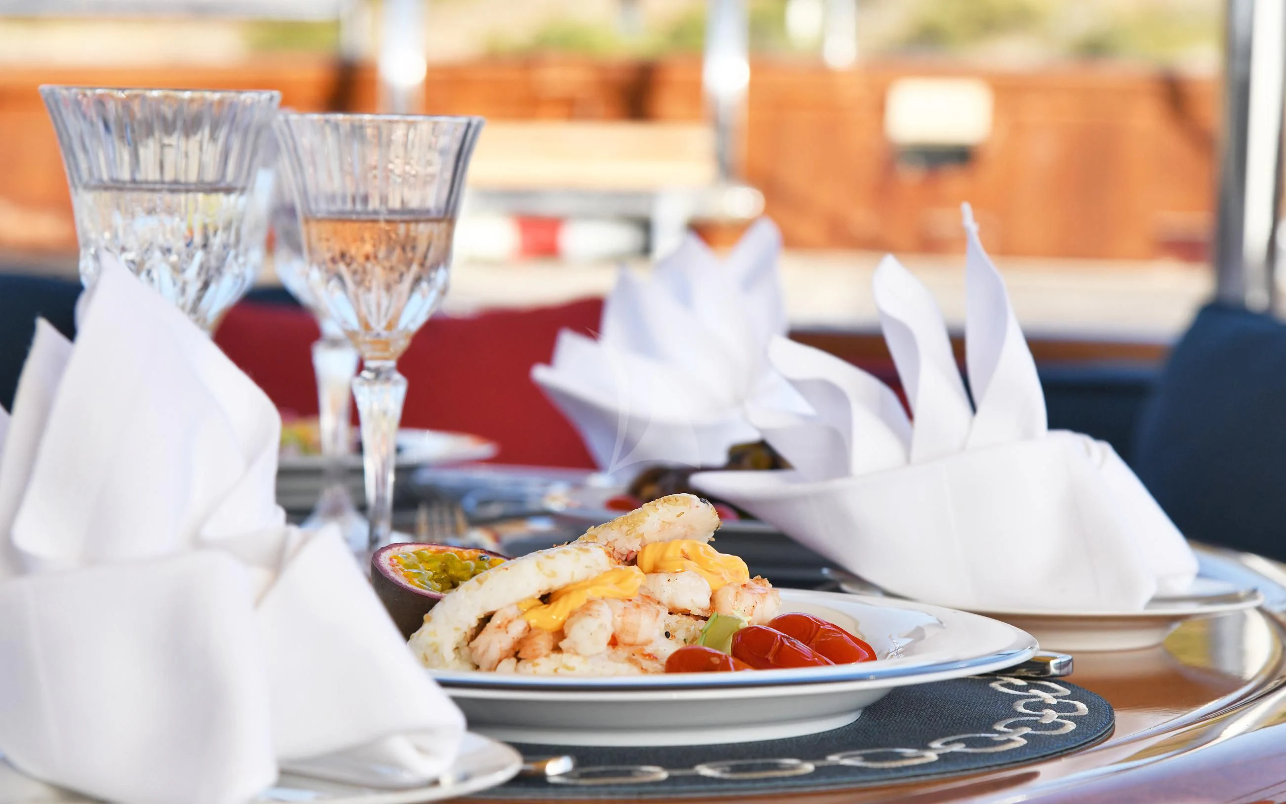 a table with food and wine aboard TAMARITA Yacht for Sale